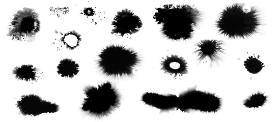 collection of small and large black dried ink spots or inkblots