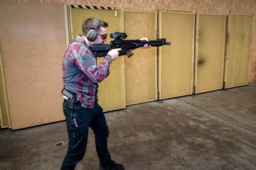 Tactical shooting from a rifle in a shooting range.