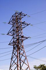 Power line pylon against the blue sky