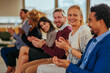 © bernardbodo - Diverse people clapping in meeting.