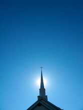 Church Steeple With Blue Sky In Background.