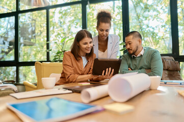 Multiracial office coworker team using digital tablet