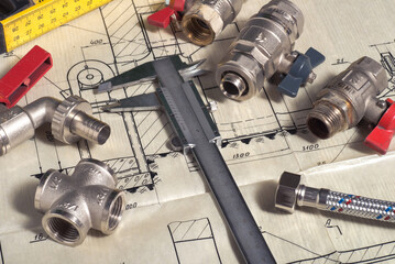 Engineering tools and details on a technical drawing. Caliper and ruler.