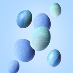 Wall Mural - Beautiful flying Easter eggs on light blue background