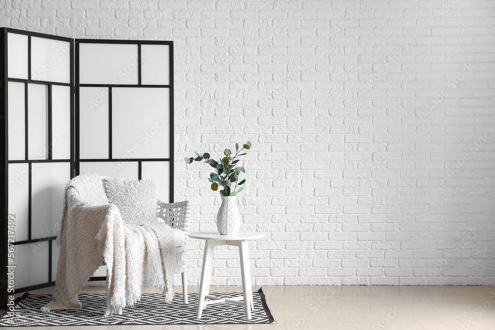 Interior of modern room with stylish folding screen