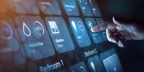 Person touching a button on smart home dashboard interface to control connected devices and set up automation technology. Using smart assistant to use and configurate home devices. Virtual screen HUD.
