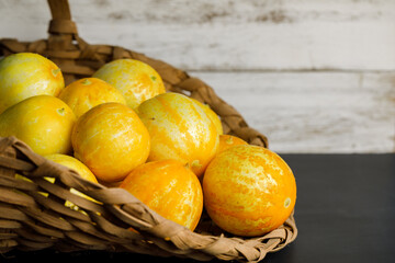 Sticker - Basket full of fresh, organically homegrown lemon cucumbers harvested from a home, urban garden