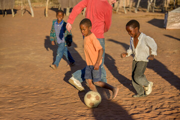 Wall Mural - African village boys playing soccer