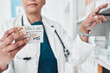 © Clayton D/peopleimages.com - Pharmacy, healthcare and pharmacist with pills, medicine and dermatology medication in clinic. Skin care wellness, pharmaceutical store and woman with medical products, ointment and cream treatment
