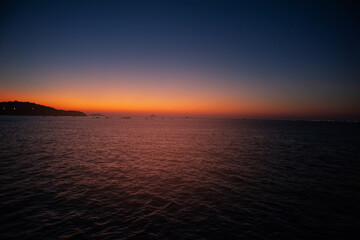  Beautiful sunset landscape with twilight sky, sundown and sea water