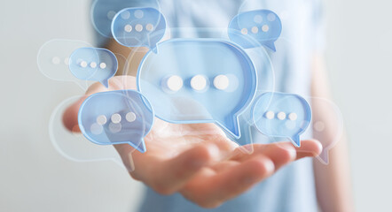 Wall Mural - Businessman using digital speech bubbles talk icons. Minimal conversation or social media messages floating over user hand. 3D rendering
