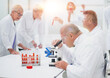 © ASDF - group of scientists conduct testing in the laboratory .