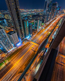 Fototapeta Nowy Jork - Warped perspective of the buildings along the Sheikh Zayed Road in Dubai taken from the 64th floor 