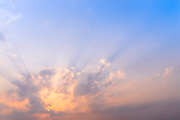 Wall Mural - sunset / sun rise sky with rays of yellow and red light shining clouds and sky background and textur