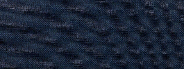 Texture of navy blue color background from textile material with wicker pattern, macro. Vintage fabric cloth,