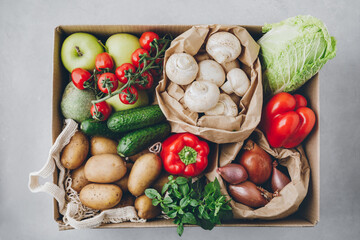 Wall Mural - Vegetables. Organic food box delivery. Tomatoes, potatoes, cucumbers, radish, basil, onions, paprika, lettuce.