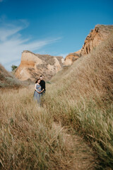 Wall Mural - pregnant girl and boyfriend on high hills