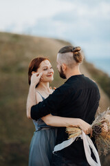 Wall Mural - wedding ceremony of a girl and a guy on high hills