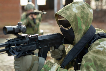 Wall Mural - A group of soldiers in a war zone playing airsoft.