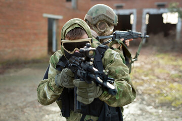 Wall Mural - Two military man with airsoft automatic rifle.