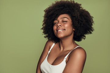 Smiling black woman with curly hair