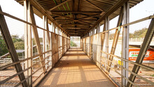 Railway Station Foot Over Bridge, Inside View Of Station Corridor, Foot Over Bridge In India At A Rural Railway Station , And Sun Ray Coming