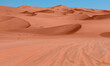 © muratart - Panoramic view of orange sand dune desert with clear blue sky at Namib desert - Namib Naukluft National Park, Namib desert, Namibia