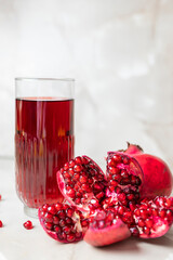 Wall Mural - delicious healthy fruit pomegranate red with juice in a glass