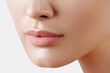 © Mirrorstudio - Lips of young beautiful woman closeup. Clean skin, nude makeup