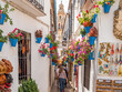 Calleja de las flores, a popular narrow street of Cordoba, Spain during the traditional flower festival of the Patios