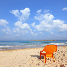 Morning On The Sea. Not Occupied Orange Beach Chair On Perfect Beach Of The Mediterranean Sea