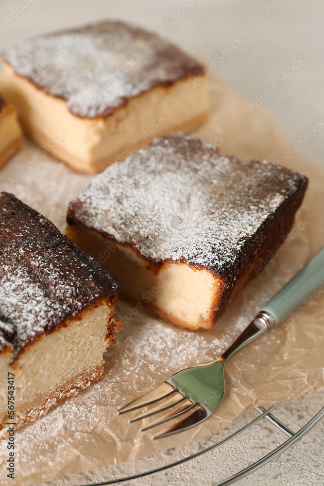 Grid with pieces of cottage cheese casserole on table, closeup