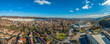 Aerial panorama of Diosgyor neighborhood in Miskolc new panel communist style block houses single family homes and the Gothic castle