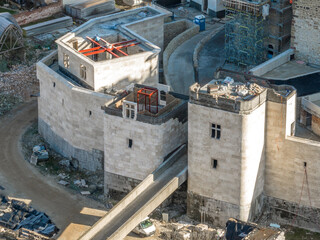 Poster - Closeup aerial view of two twin square gate towers being restored in medieval Diosgyor castle in Miskolc Hungary