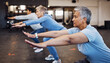 © S Fanti/peopleimages.com - Teamwork, exercise and senior women stretching arms in gym for flexibility, health and wellness. Sports, training or group of elderly retired female friends workout or exercising together for fitness