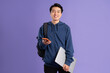 © Q88 - Asian male student portrait on purple background