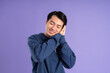 © Q88 - portrait of asian man posing on purple background