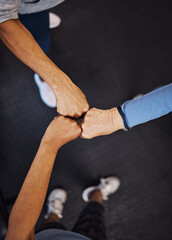 Canvas Print - Teamwork, top view and senior women fist bump for team building, motivation and unity. Support, collaboration and group of elderly friends huddle for trust, union or solidarity, goals or targets.