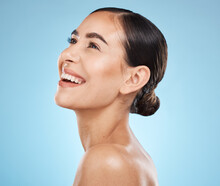 Skincare, Wellness And Woman In Studio With A Healthy, Natural And Cosmetic Face Treatment. Beauty, Cosmetics And Happy Female Model From Brazil With Makeup Facial Routine Isolated By Blue Background