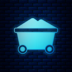 Sticker - Glowing neon Coal mine trolley icon isolated on brick wall background. Factory coal mine trolley. Vector