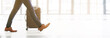 © Chanel M/peopleimages.com - Travel, floor and businessman walking with luggage for work, airport arrival and conference. Corporate, working and legs and shoes of an employee on a trip for business and professional seminar