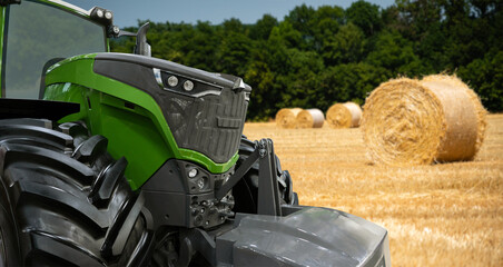 Autocollant - Agricultural tractor on a background of straw bales 