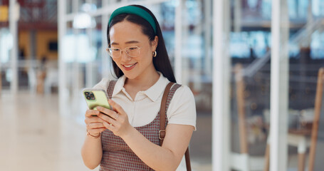 Canvas Print - Phone, mall and Asian woman typing, social media or messaging. Technology, coffee and happy female with mobile smartphone for networking, internet browsing or web scrolling alone at shopping mall.