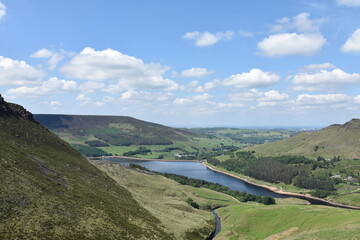 Wall Mural - Countryside view with green hills and mountains with a lake in distance. Taken in Oldham England. 