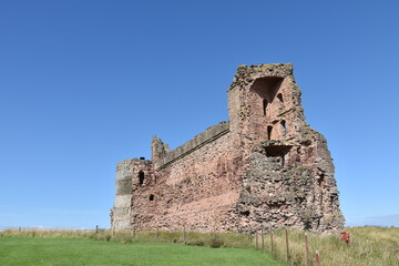 Poster - Looking up at the ruins of a castle with a blue sky background. Tantallon castle North Berwick Scotland. 