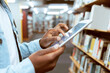 © Jade Maas/peopleimages.com - Student hands, tablet zoom and library research of a black man at an education and knowledge center. University, college and study building with a person with technology looking at social media app
