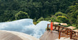 © Jacob Lund - Woman near infinity swimming pool in nature