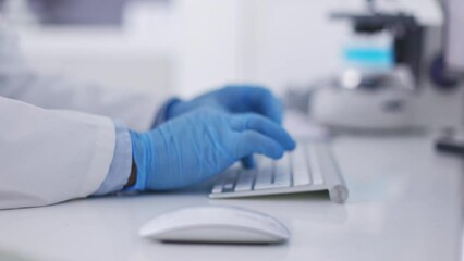 Hands, computer and scientist typing for analysis, innovation and research for healthcare or online development. Zoom, blue gloves and device for digital planning, search internet and keyboard in lab