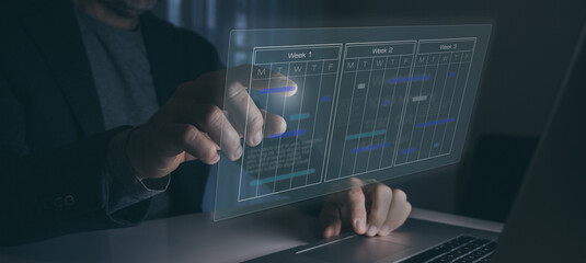 Businessman use calendar for appointments and organize agenda. Planning events on virtual screen.