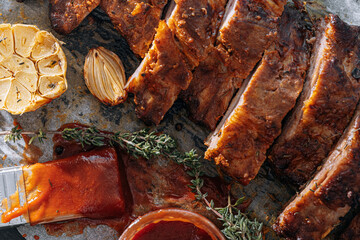 Wall Mural - Smoked BBQ Ribs from a summer barbecue in nature.